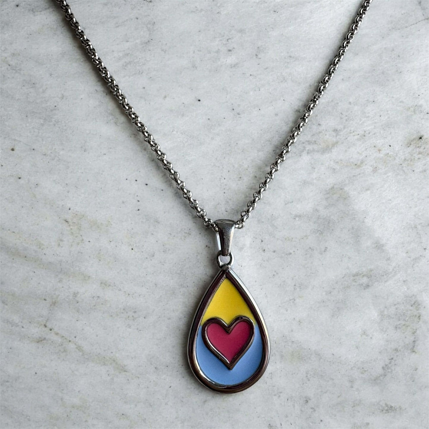 Beside Me Always Comfort Pendant. An autism-friendly pendant designed with calming colours.